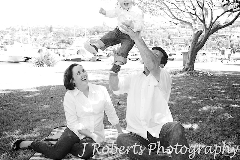 Little boy being thrown into the air - family portrait photography sydney